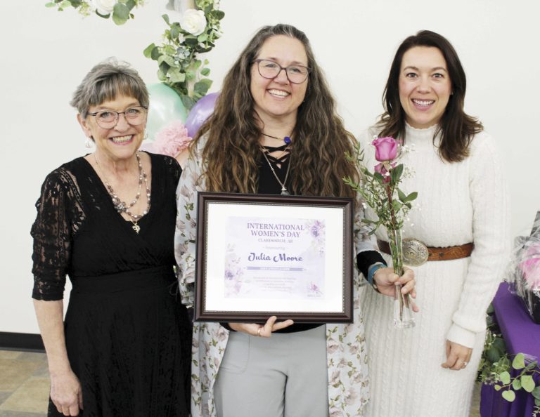 educational leader - Julia Moore was honoured as the Educational Leader at the International Women’s Day celebration at the Claresholm Social Centre on March 8. From left are Mary Holgate, one of the event organizers, Moore, and Chelsae Petrovic, MLA for Livingstone-Macleod. Photo by Rob Vogt