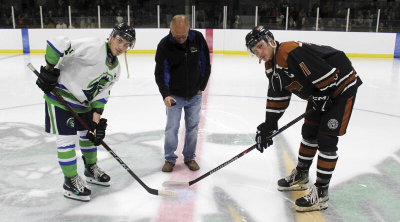 hockey night in claresholm - The Claresholm Cowboys began their inaugural season in the United States Premier Hockey League on Saturday night, Sept. 26, at Claresholm Arena. Here Claresholm Mayor Brad Schlossberger drops the puck for the ceremonial opening face off between Claresholm Captain Dustyn Stoesz, at right, and Three Hills Captain Blake O'Dempsey, at left. Photo by Rob Vogt
